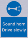 sound-horn-drive-slowly-warehousing-and-delivery-sign~